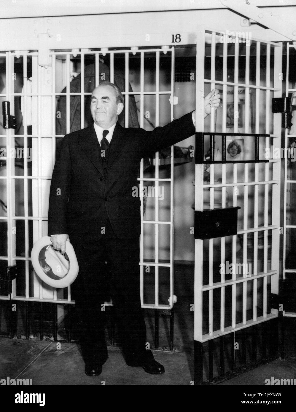 Where Mooney Will Live During Hearing - Thomas J. Mooney is pictured in front of the cell in the San Francisco jail where he will live during the hearing ordered by the state supreme court on his habeas corpus proceedings to gain vindication of the 1916 San Francisco Prepardenss day bombing. He was brought to San Francisco early today from San Quentin prison, where he has been serving a life sentence. Mooney was granted permission to attend the hearings. January 09, 1935. (Photo by Associated Press Photo). Stock Photo
