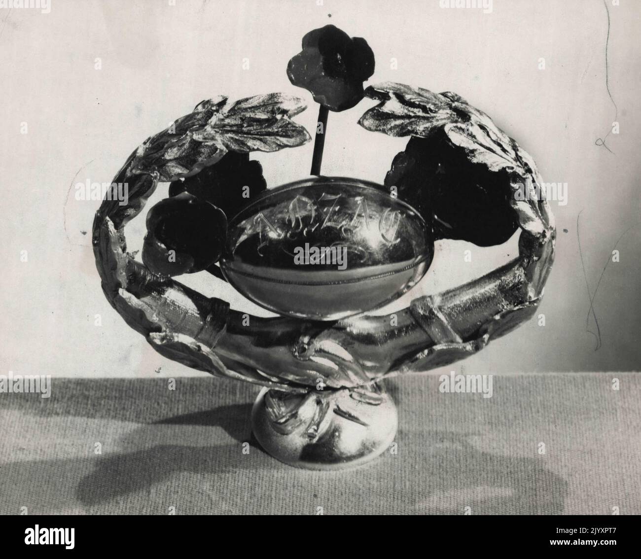 This silver symbol is portion of the Courtney International Goodwill