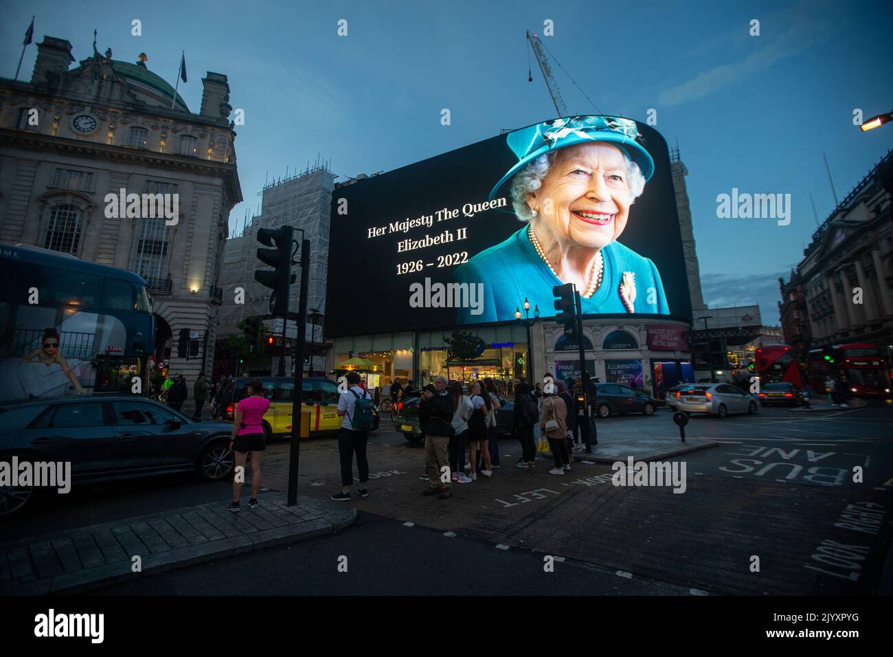 London, England, UK. 8th Sep, 2022. A tributet to Queen Elizabeth II is on display on giant screen in Piccadilly Circus after her death announcement. (Credit Image: © Tayfun Salci/ZUMA Press Wire) Stock Photo