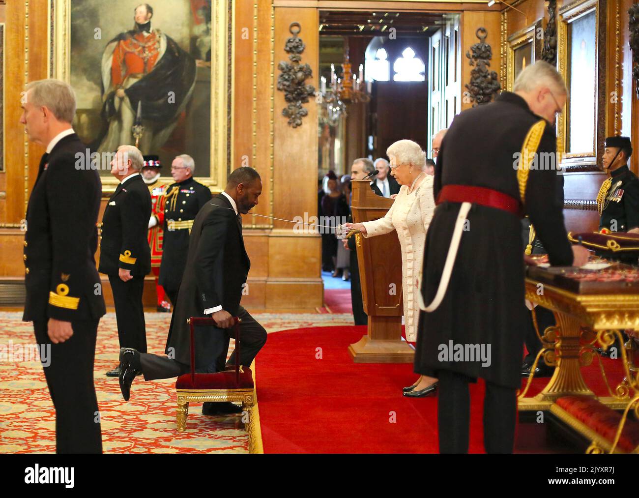 File photo dated 4/12/2025 of Sir Lenny Henry is knighted by Queen Elizabeth II during an Investiture ceremony at Windsor Castle. The Queen has personally held more than 660 Investitures since the start of her reign. Issue date: Thursday September 8, 2022. Stock Photo