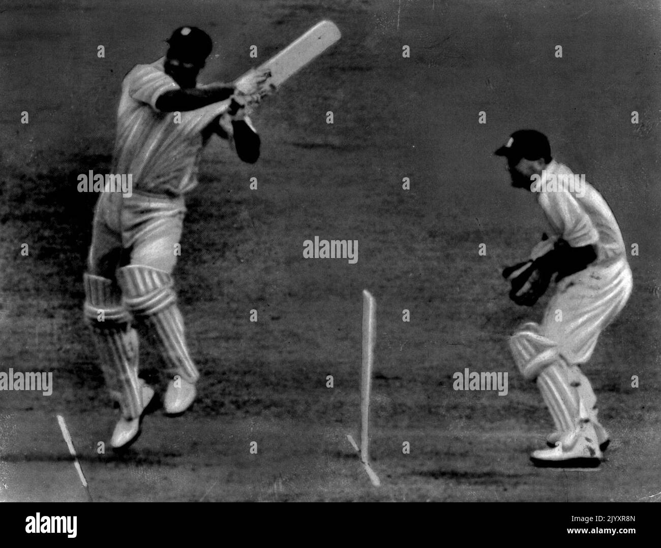 Clyde Walcott hooks Lock for four during his 220 in the second Test against England. Walcott is now rated No. 1 batsman in the 'W's Trinity. March 25, 1955. Stock Photo