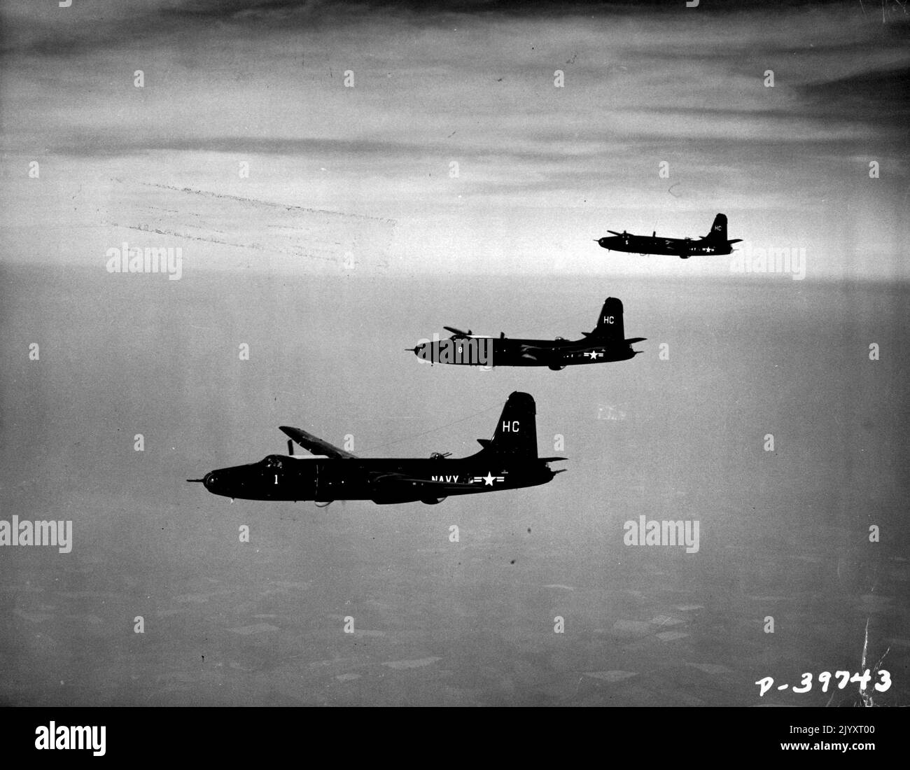 Rockettes Of The Air -- Navy pilots demonstrate their skill in flying formation with Martin P4M-1 Mercators, long-range patrol airplanes. The big four-engine (two piston, two jet) planes built by The Glenn L. Martin Company for the Navy are in service with VP-21,a Fleet squadron based at the Naval Air Test Center, Patuxent River, Maryland. While the Mercators look like a twin-engine aircraft, each nacelle for Pratt & Whitney R-4360 piston engines also houses an Allison J-33 jet for additional power. and speed when needed. For their role as anti-submarine planes, Mercators are equipped with the Stock Photo