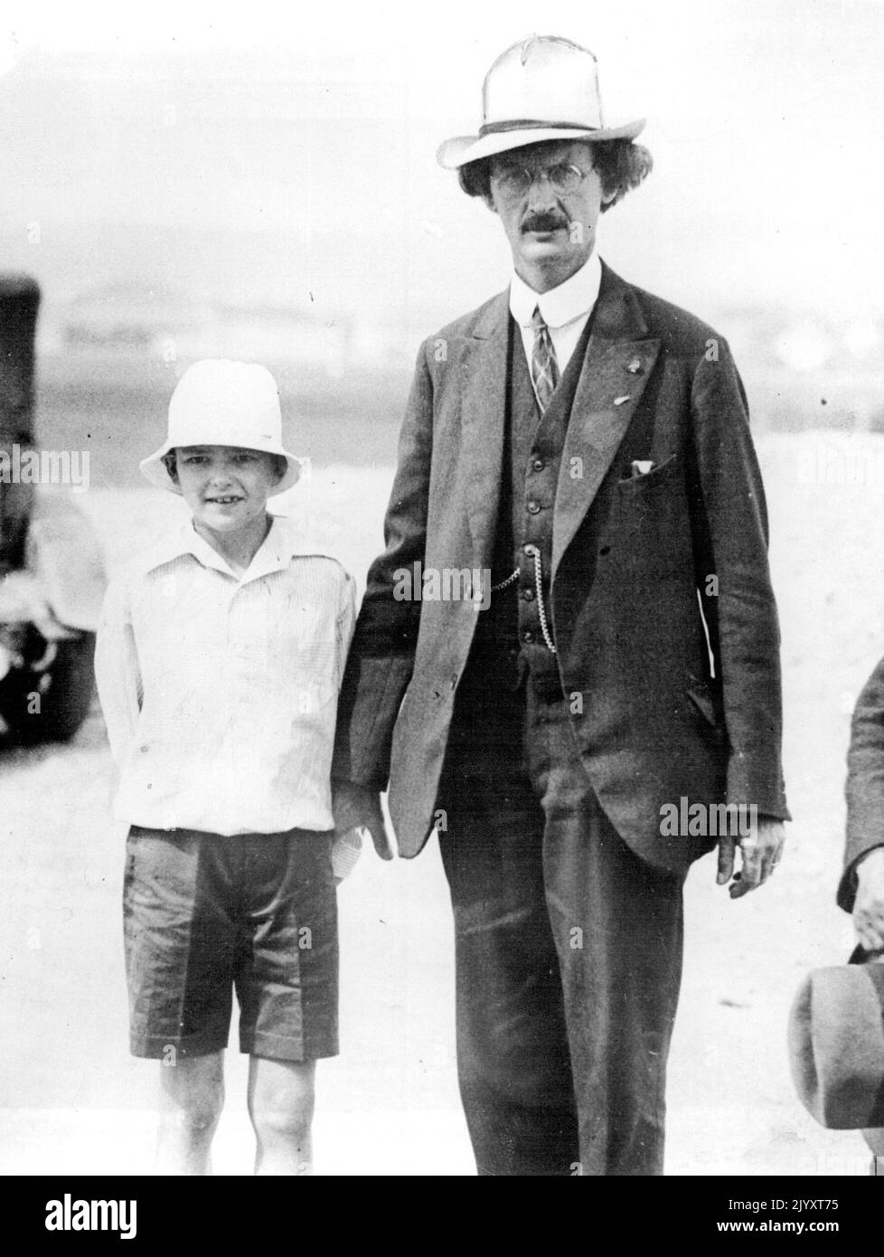 Professor Piccard Ready -- Professor Piccard with his son the airfield at Zurich. Professor Piccard is at Zurich, Switzerland and plans to make his new ascent into the stratosphere today August 10. He goes with a companion to collect more scientific data. September 26, 1932. (Photo by Associated Press Photo). Stock Photo