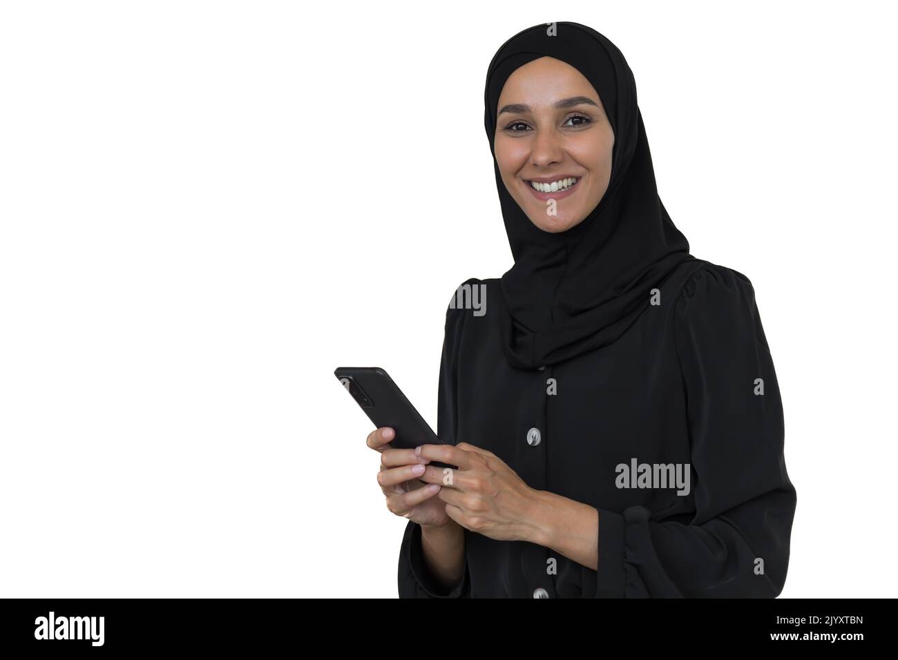 Young beautiful Muslim woman in black hijab on white background looking ...