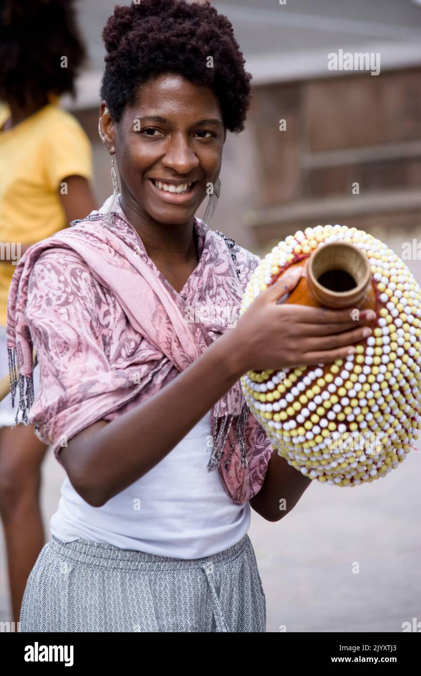 Salvador, Bahia, Brazil - September 17, 2016: Woman playing Abe or Xequere, percussion musical instrument created in Africa. Salvador, Bahia, Campo Gr Stock Photo