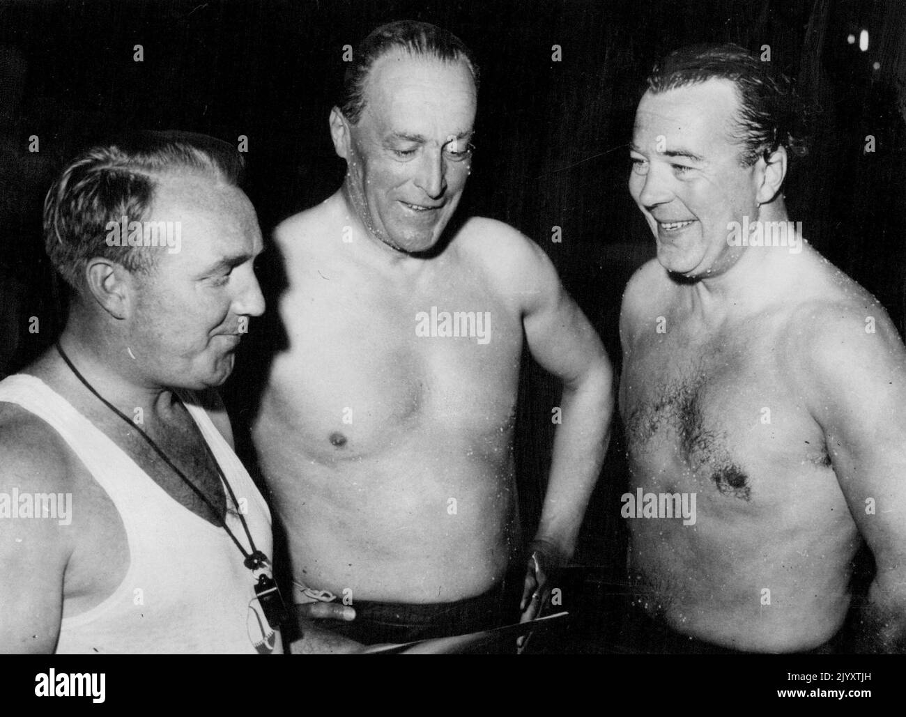 A Prince Goes Swimming Stockholm: Still wet after a swim in the Sport Palates pool here, Prince Bertil of Sweden, right, chats with swimming instructor Tage Lindstroem (left). Man in centre is Bo Ekelund. The Prince had been making a bid to gain his swimming certificate. June 14, 1951. Stock Photo