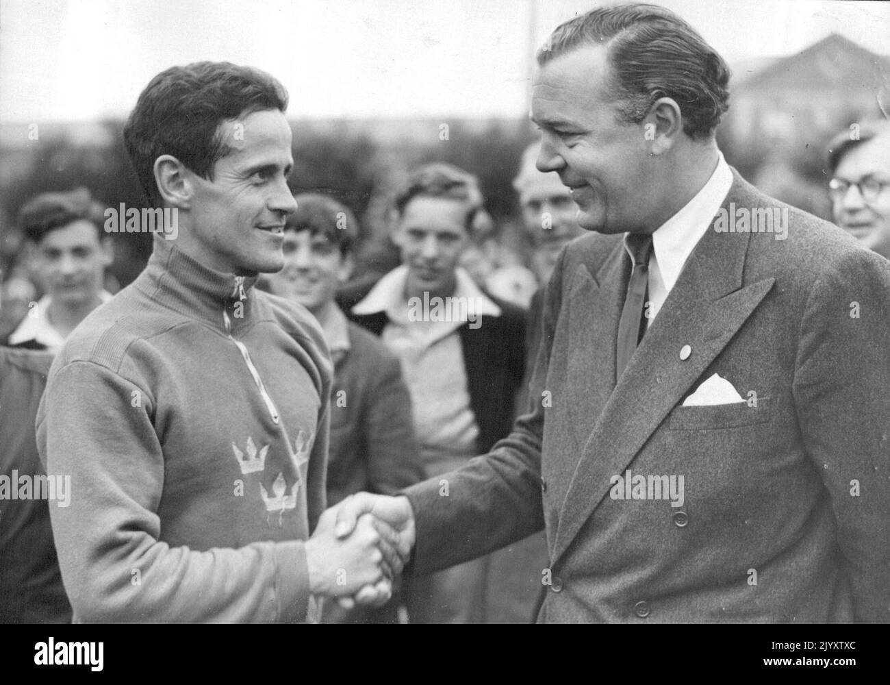Prince Congratulates world's best athlete Sweden wind Olympic Pentathlon sets New record Camberley, Eng: Captain W.O.G. Grut of Sweden (left) is congratulated by Prince Bertil of Sweden after the 4,000-meters cross country run which was final test of the Olympic games modern Pentathlon and confirmed Grut as winner of the combined event. Grut finished eighth in the run in 15 minutes 28.9 seconds but had secured first place in three of the previous tests riding, fencing and swimming to achieve a total of 16 points. This is a new Olympic record, the previous record having been 17 points. August 0 Stock Photo