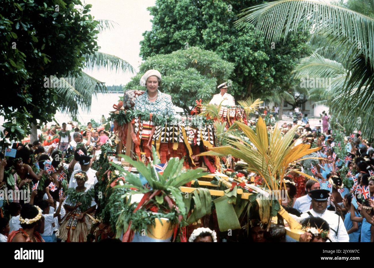 File photo dated 26/10/1982 of Queen Elizabeth II and the Duke of Edinburgh being carried shoulder high in canoes during their visit to Tuvalu, in the South Sea Islands. Issue date: Thursday September 8, 2022. Stock Photo