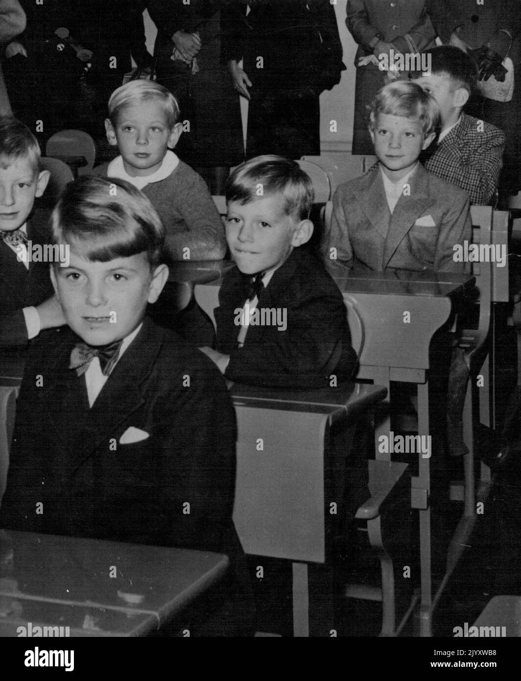 Swedish Crown Prince Starts School On September 8th the Swedish Crown prince Carl Gustaf took another step in life. He left kindergarten and went to school. At the age of seven he sits with nineteen other Boys in a classroom just like other Swedish boys of his age. He is seen here, Third from the front, in the school Classroom with his future school chums. In Front of him second from front sits Hans Jorgen Zetterstrom, son of ' Kar de Mumma' A well known Swedish Writer. November 2, 1953. (Photo by Associated Press Photo) Stock Photo