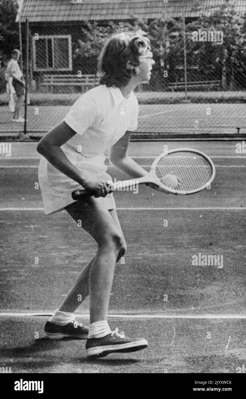 A Princess In Service Photo shows: Princess Desiree, grand daughter of King Gustav Adolf of Sweden in action on the course of a Stockholm tennis club. The Princess is an enthusiastic Iearnor with her two sisters, the Princesses Margaretha and Birgitta. July 31, 1951. (Photo by Sport and General Press Agency Limited) Stock Photo