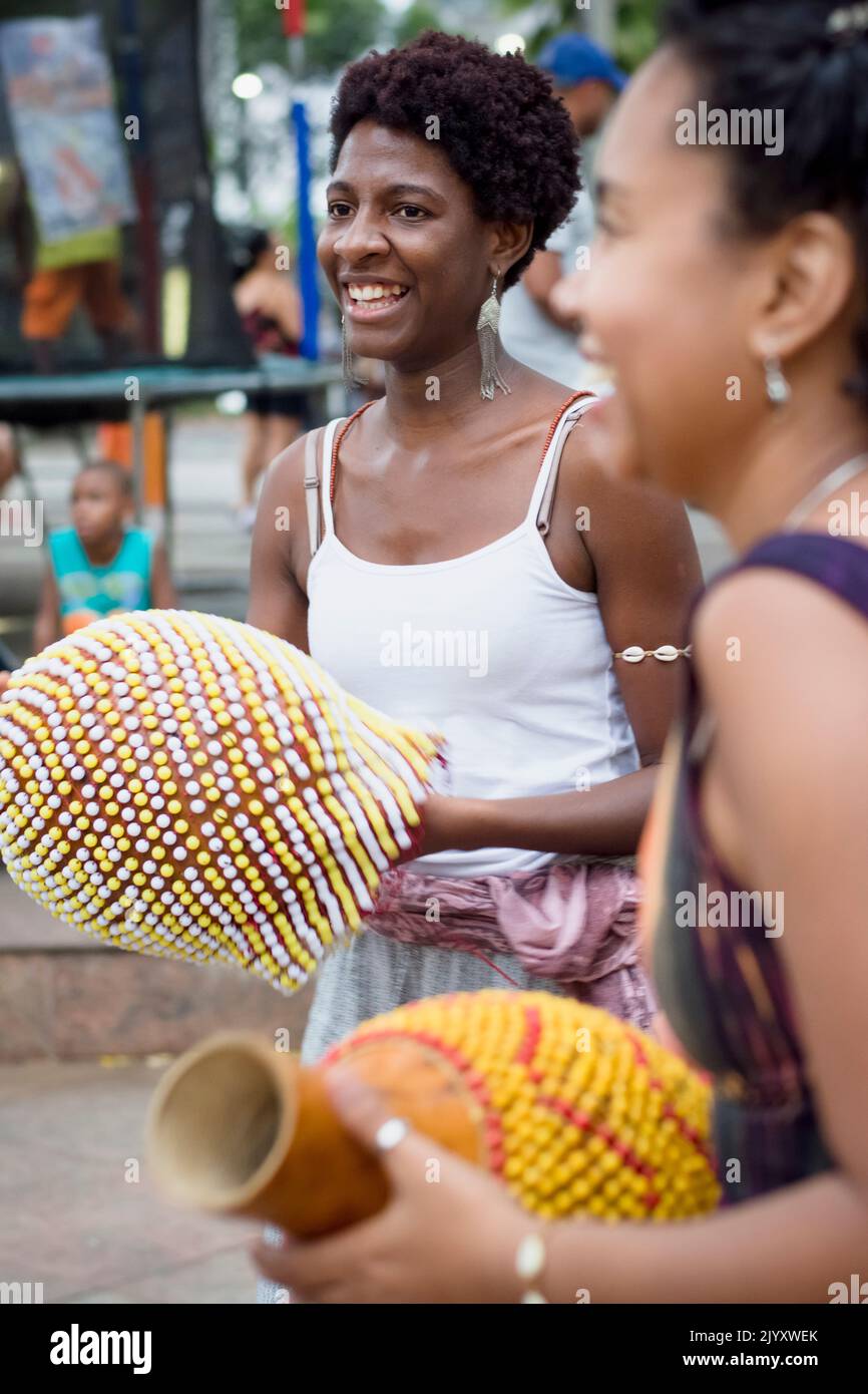 Salvador, Bahia, Brazil - September 17, 2016: Women playing Abe or Xequere, percussion musical instrument created in Africa. Salvador, Bahia, Campo Gr Stock Photo