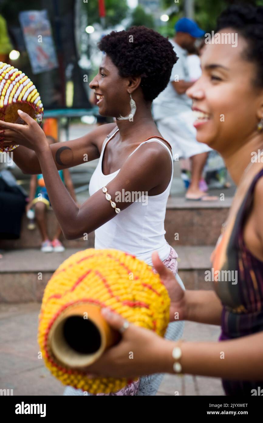 Salvador, Bahia, Brazil - September 17, 2016: Women playing Abe or Xequere, percussion musical instrument created in Africa. Salvador, Bahia, Campo Gr Stock Photo