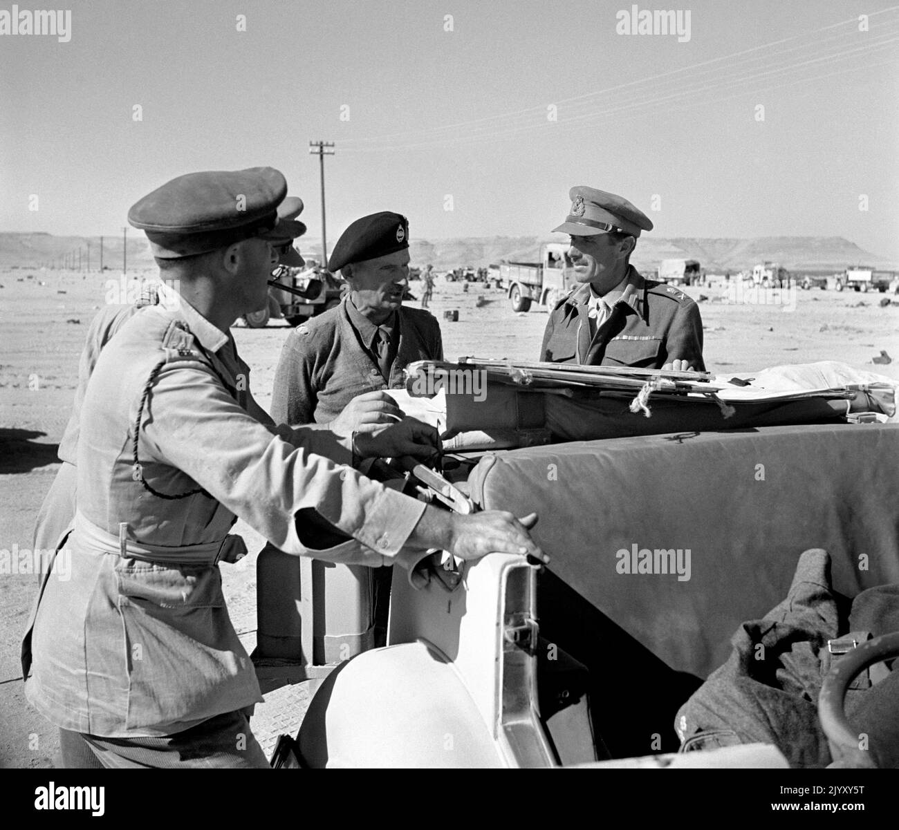 1942: File photo dated October 1942 of General Bernard Montgomery (c), commander of the British Army in North Africa during the Western Desert campaign, conferring with staff officers, including Lieutenant-General Herbert Lumsden, X Corps (r), before the decisive battle of El Alamein. Issue date: Thursday September 8, 2022. Stock Photo