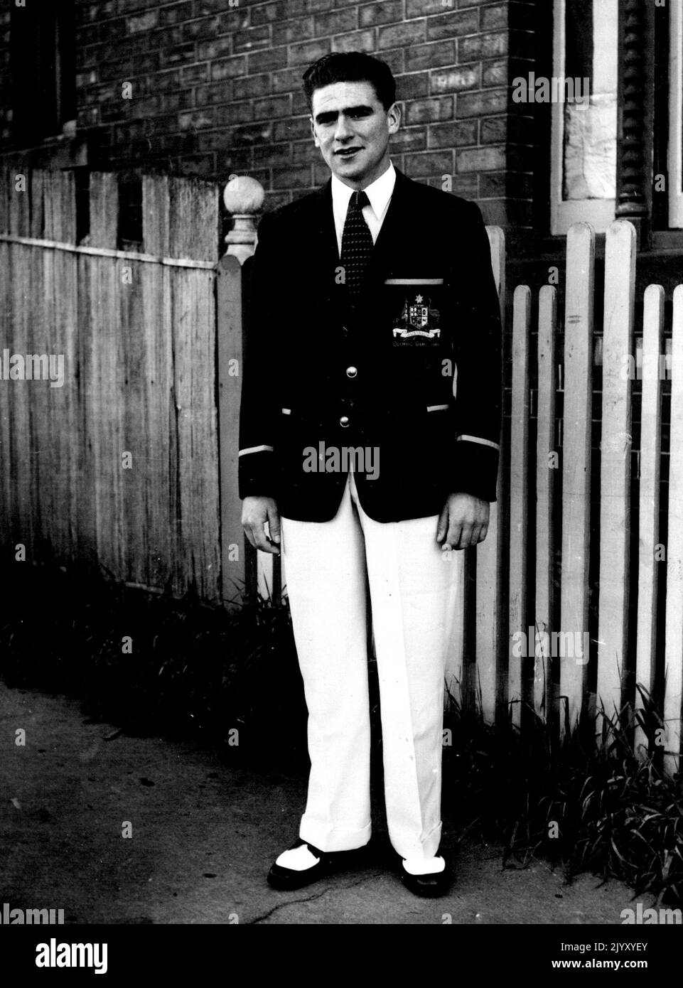 Uniform. Crack Olympic cyclist Sid Patterson in the uniform for men of the Australian Olympic team. Panama hats will be issued in England. Aussie Gets off his Bike!: Australian Olympic cyclists are not complaining at roughness they have found in competitive racing in England, but are ready to deal with it in their won way. In a recent event, a local rider grabbed Sid Patterson's arm and pulled him back. Afterwards, in the dressing room, Patterson warned all and sundry about the fate awaiting any future offender. July 20, 1948. Stock Photo