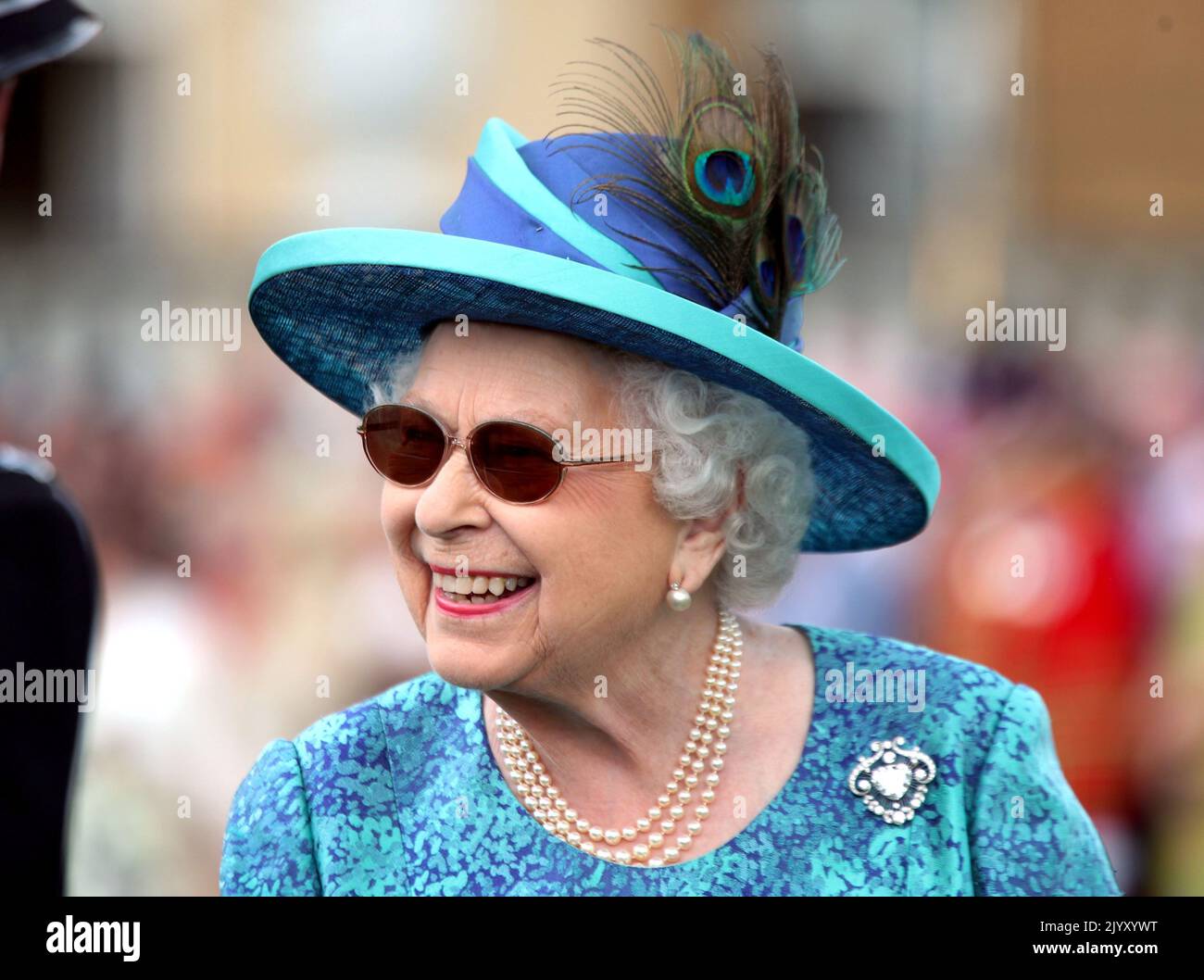 File photo dated 31/5/2018 of Queen Elizabeth II during a garden party at Buckingham Palace in London, and wearing sunglasses after successful surgery to remove a cataract from one of her eyes. The Queen was in robust health for most of her life and seldom took time off during her lengthy reign and illnesses were few and far between over the years. Issue date: Thursday September 8, 2022. Stock Photo