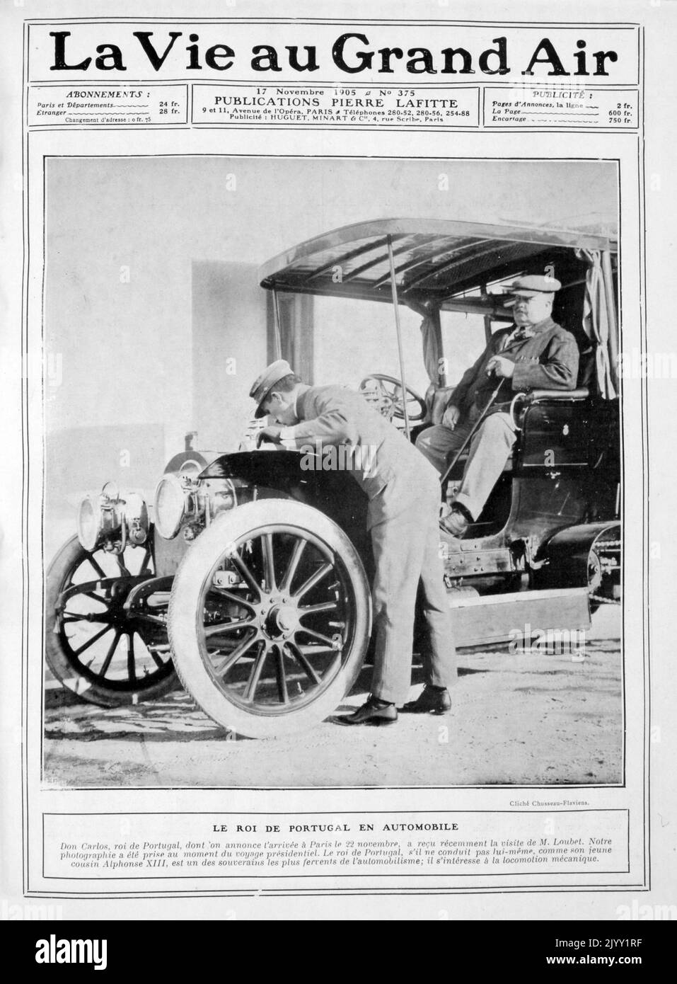 King Alphonso XIII attends to the engine of a car as Dom Carlos I of Portugal looks on. Don Carlos (known as the Diplomat or the Martyr); 1863 - 1908, was the King of Portugal and the Algarve's. 1905 Stock Photo