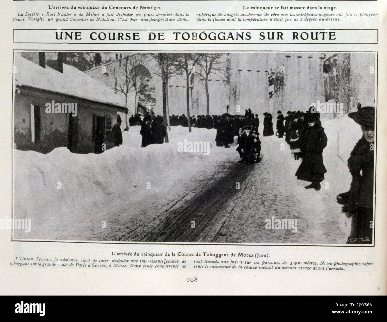 Vintage Swiss Photograph of crowd watching toboggan in the snow covered streets near Geneva, Switzerland 1905. Stock Photo