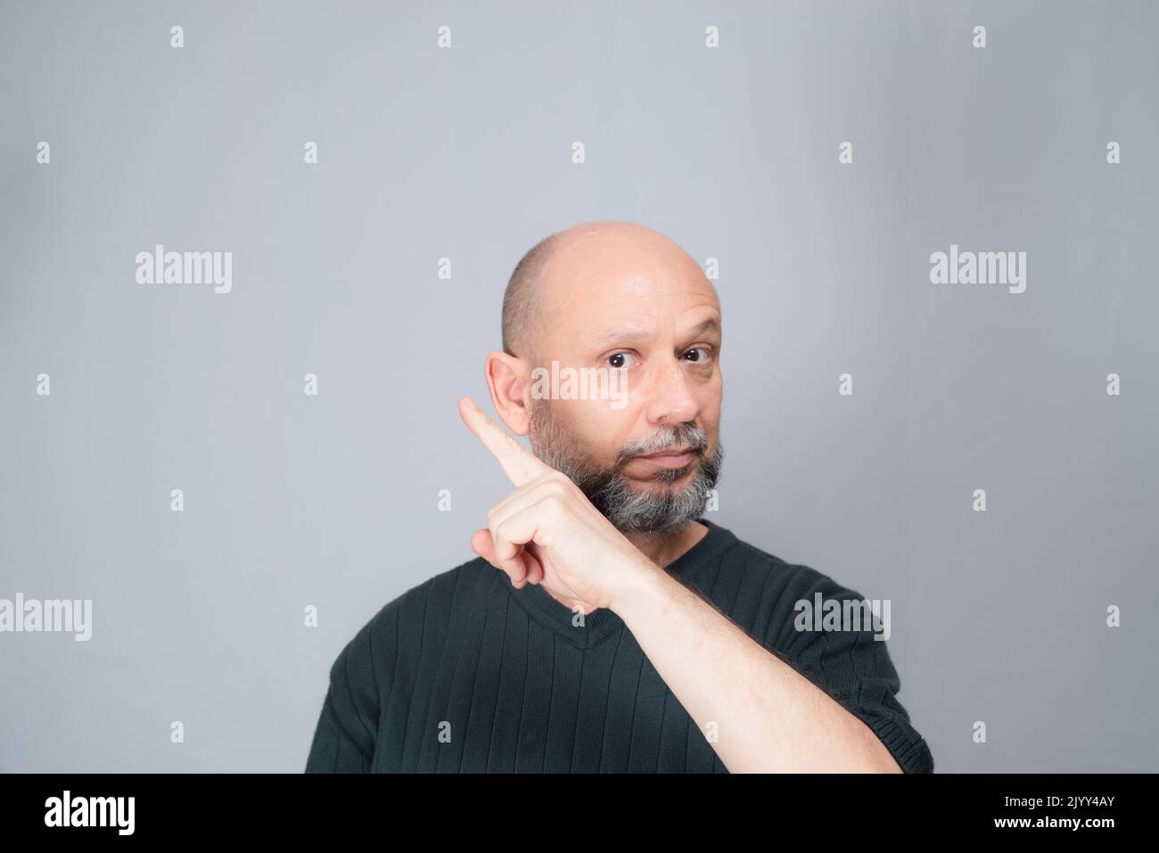 Portrait of mature man standing on white background. Bald bearded man ...