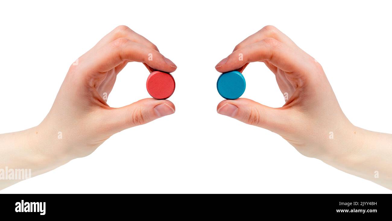 Hands holding red and blue pills isolated on white background. Choice between two options, truth, reality and illusion. Matrix, conspiracy concept. Hi Stock Photo