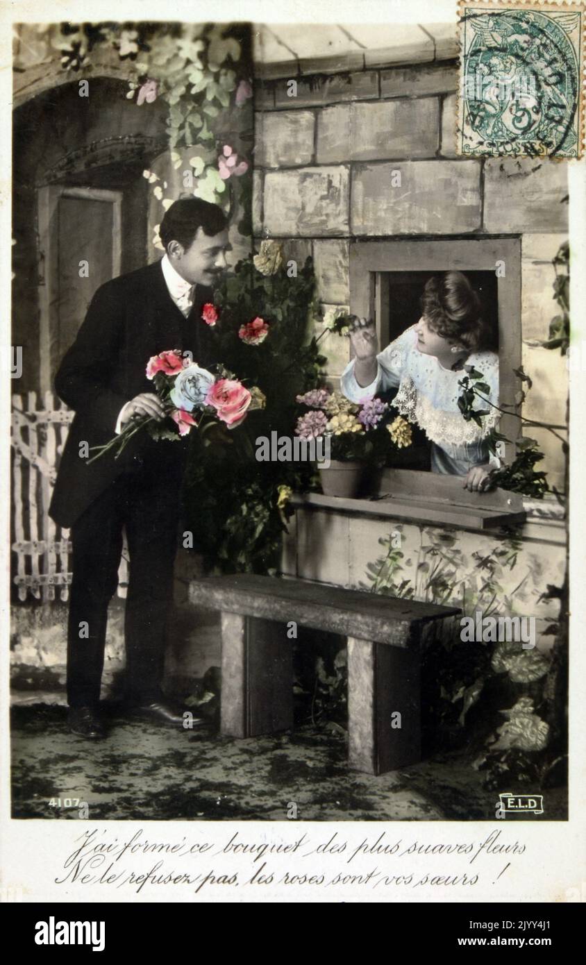 Vintage French postcard showing a photograph of a romantic couple Stock Photo