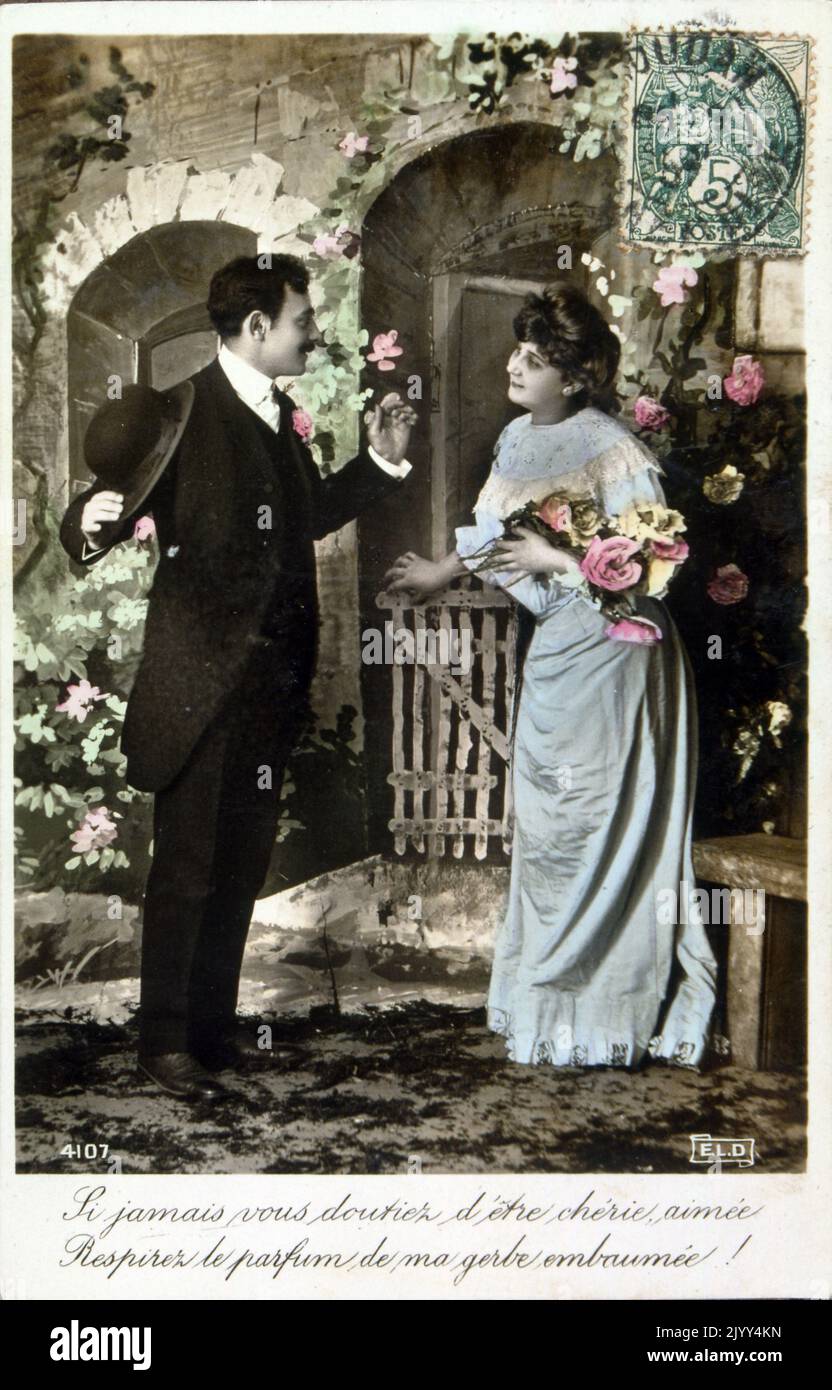 Vintage French postcard showing a photograph of a romantic couple Stock Photo