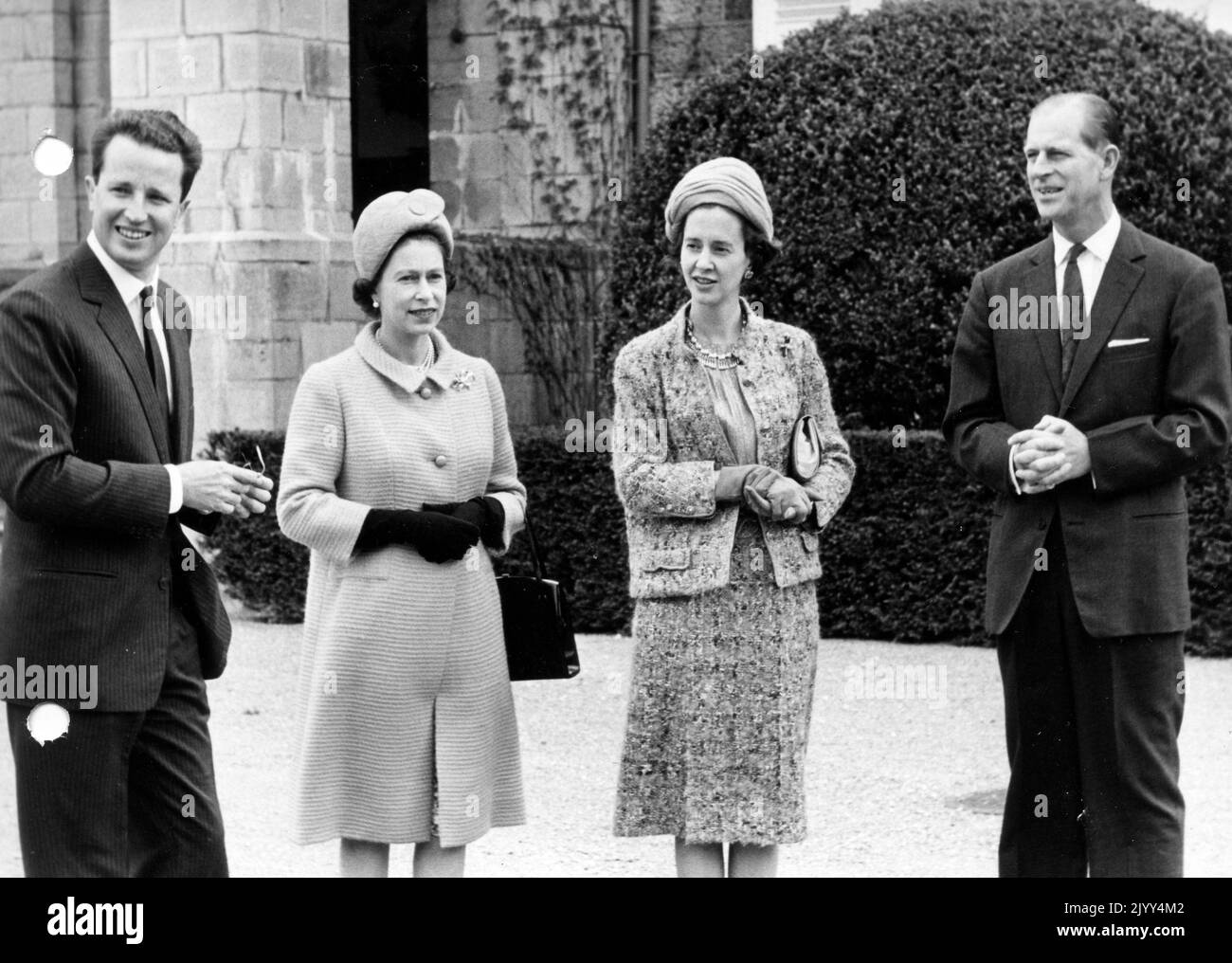 19660512 - CIERGNON, BELGIUM (FILE) : This file picture dated 12 May 1966 is about United Kingdom sovereigns visit to Belgium. On this picture : Queen Elizabeth II, Prince Philip of United Kingdom and Belgian sovereigns Baudouin and Fabiola in front of Ciergnon castle. BELGA PHOTO ARCHIVES Stock Photo