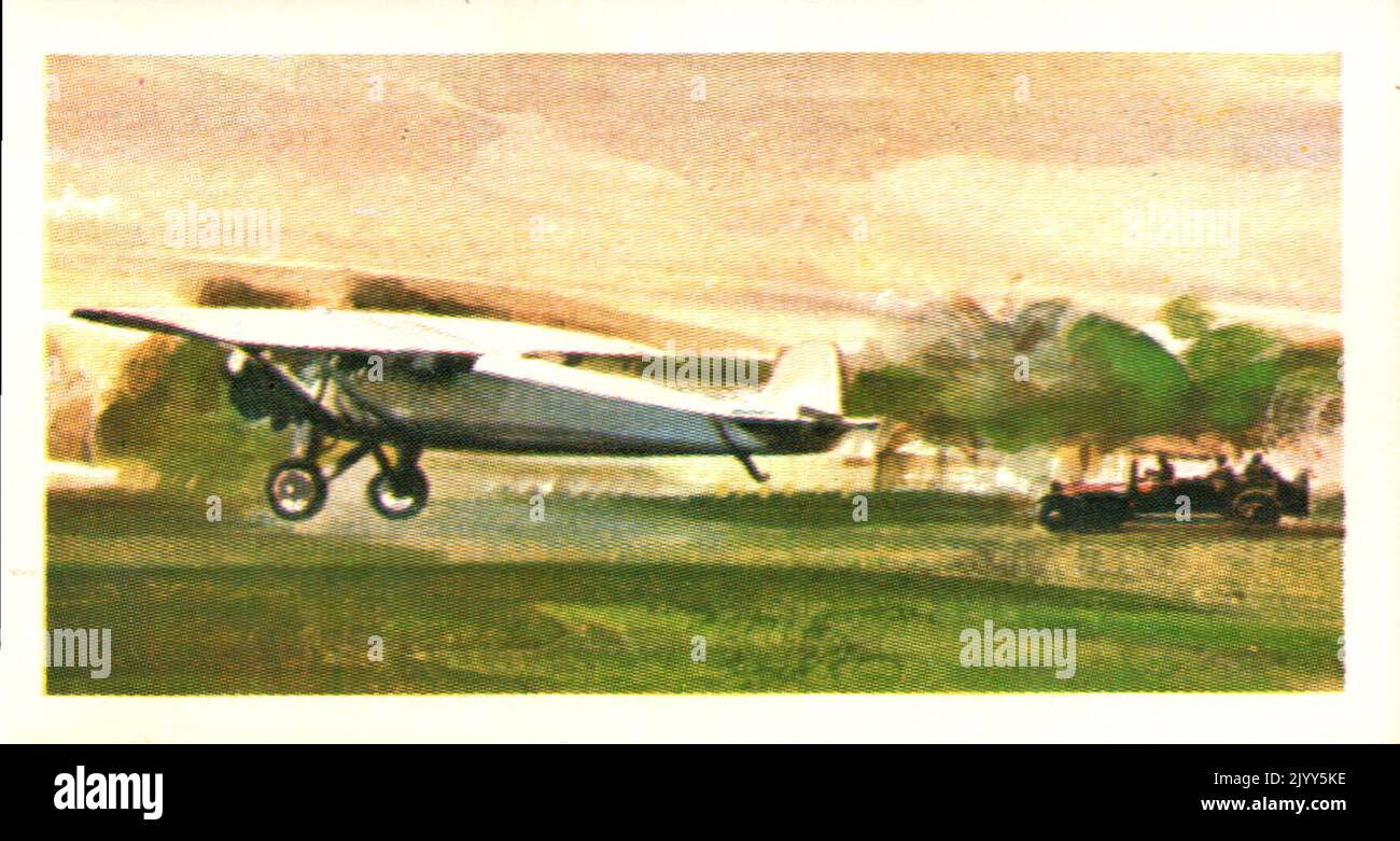 from a series of cards for Brooke Bond Tea; 1973; 'Adventurers & Explorers', illustrated by John ; depicting illustrated colour image of Charles Lindbergh (1902-1974), American; colour Illustration of Lindbergh taking off from Roosevelt Field in 1927 (A series of 50 cards, no. 38). Stock Photo