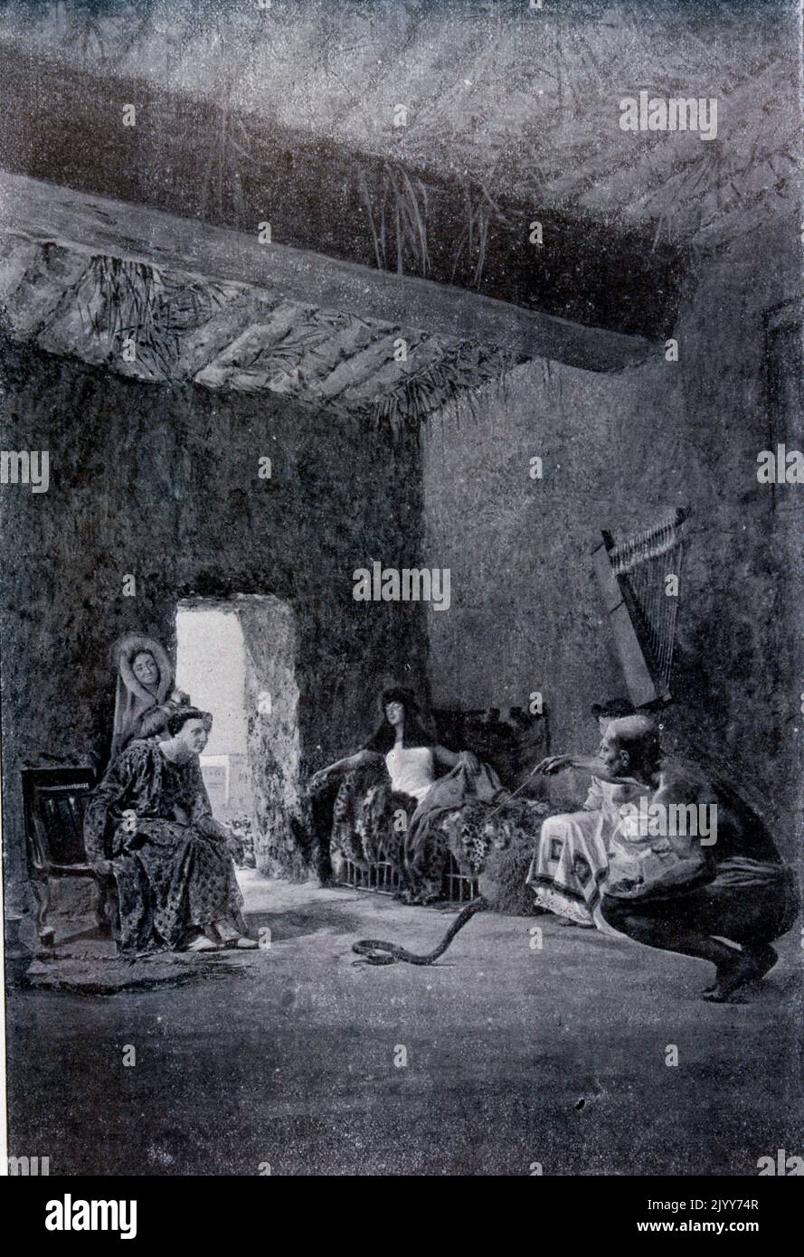 Exposition Universelle (World Fair) Paris, 1900; black and white photograph of a interior scene demonstrating serpent charmers with costumes worn from 1897. Stock Photo