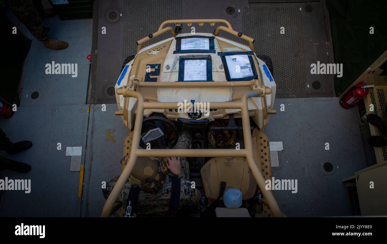 U.S. Marine Cpl. Jocob Trevor, 1st Battalion, 8th Marines, embarks a Utility Task Vehicle onto a Swedish Hovercraft 2000, during exercise Archipelago Endeavor 2022 (AE22), at Berga Naval Base, Sweden, September 6, 2022. AE22 is an integrated field training exercise that increases operational capability and enhances strategic cooperation between the U.S. Marines and Swedish forces. (U.S. Marine Corps photo by Lance Cpl. Adam Scalin) Stock Photo