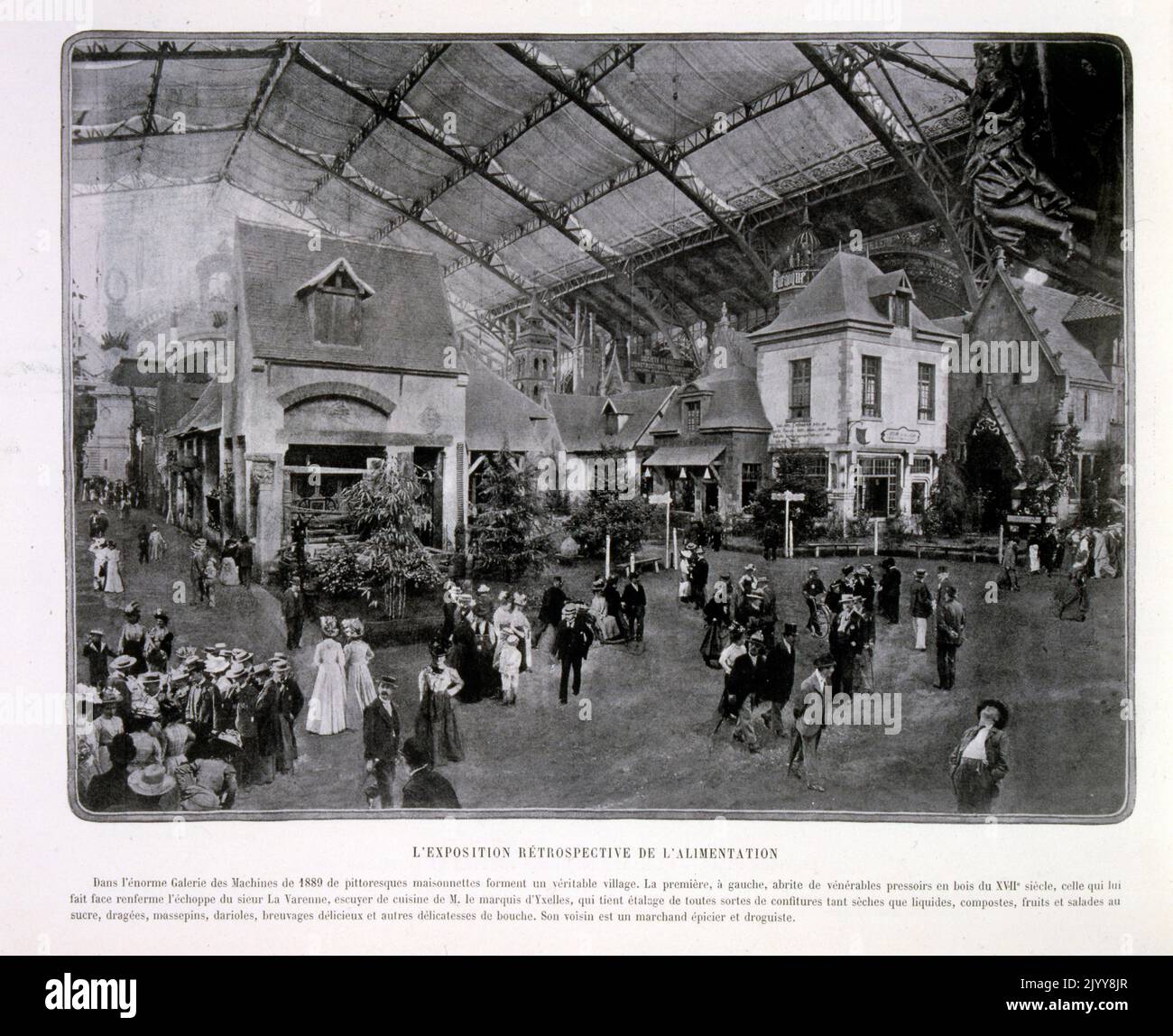 Exposition Universelle (World Fair) Paris, 1889; a black and white photograph of the exhibition of old fashioned types of food and traditional houses in the Gallery of Machines. Stock Photo