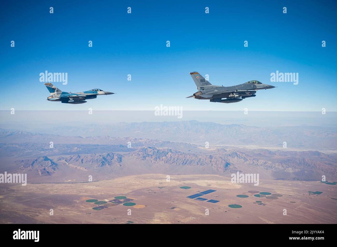 Two F-16 Fighting Falcons fly over the Nevada Test and Training Range ...