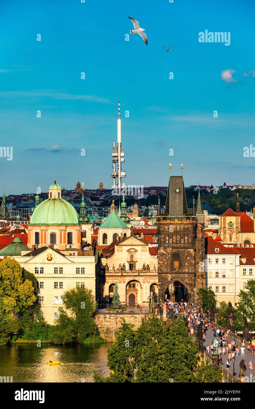 Old town of Prague. Czech Republic over river Vltava with Charles Bridge on skyline. Prague panorama landscape view with red roofs.  Prague view from Stock Photo