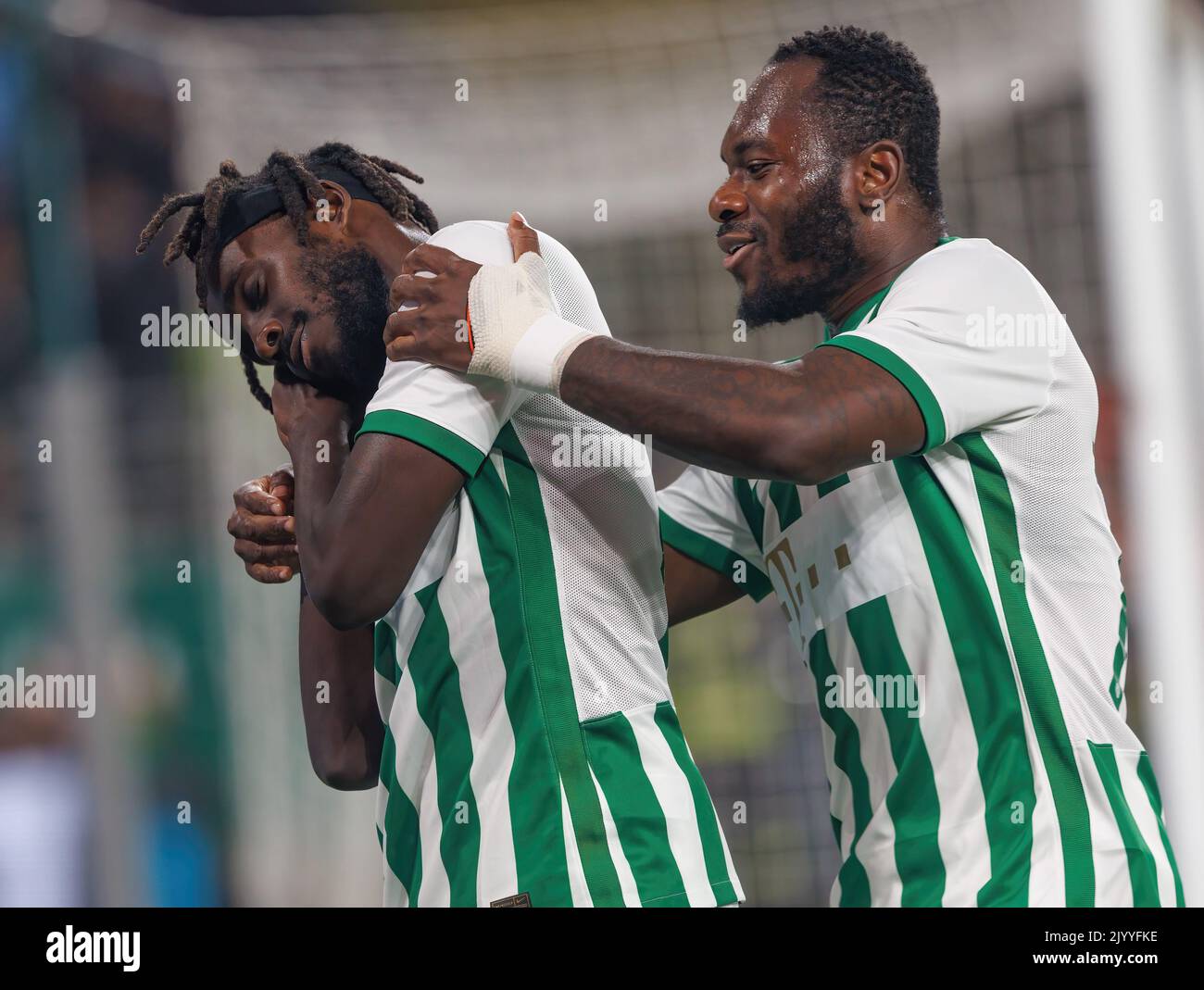 BUDAPEST, HUNGARY - AUGUST 29: (l-r) Tokmac Chol Nguen of Ferencvarosi TC  celebrates his goal in front of Gergo Lovrencsics of Ferencvarosi TC during  the UEFA Europa League Play-off Second Leg match