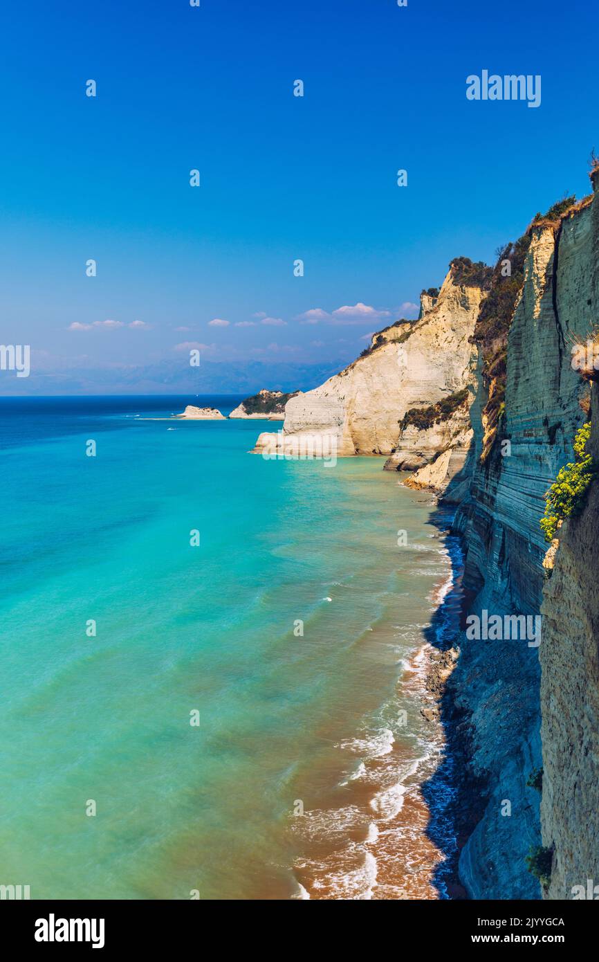 Beautiful view of Cape Drastis in the island of Corfu in Greece. Cape Drastis, the impressive formations of the ground, rocks and the blue waters pano Stock Photo