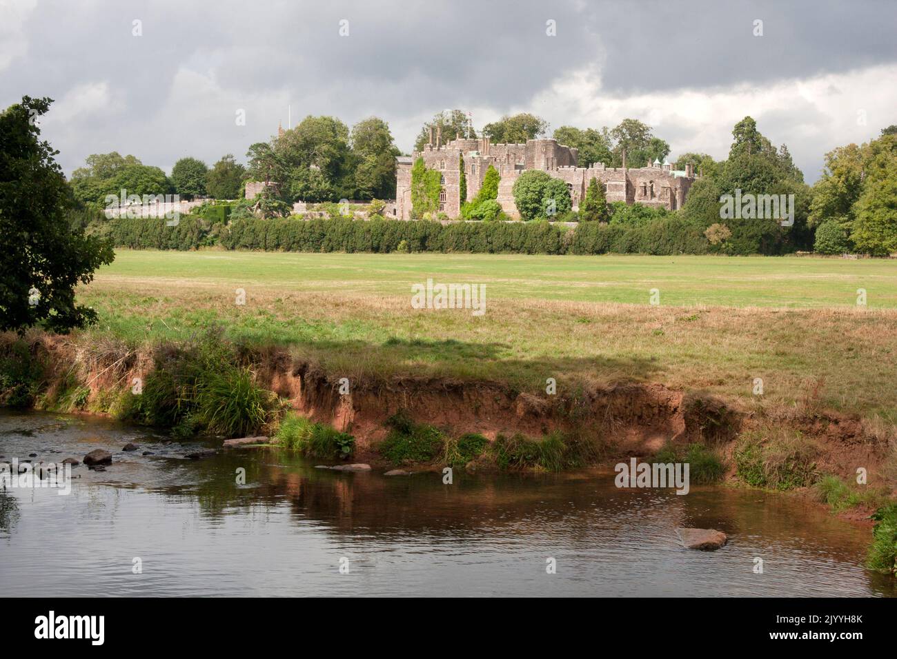 Berkeley Castle across the Little Avon river, Berkeley, Gloucestershire, England Stock Photo