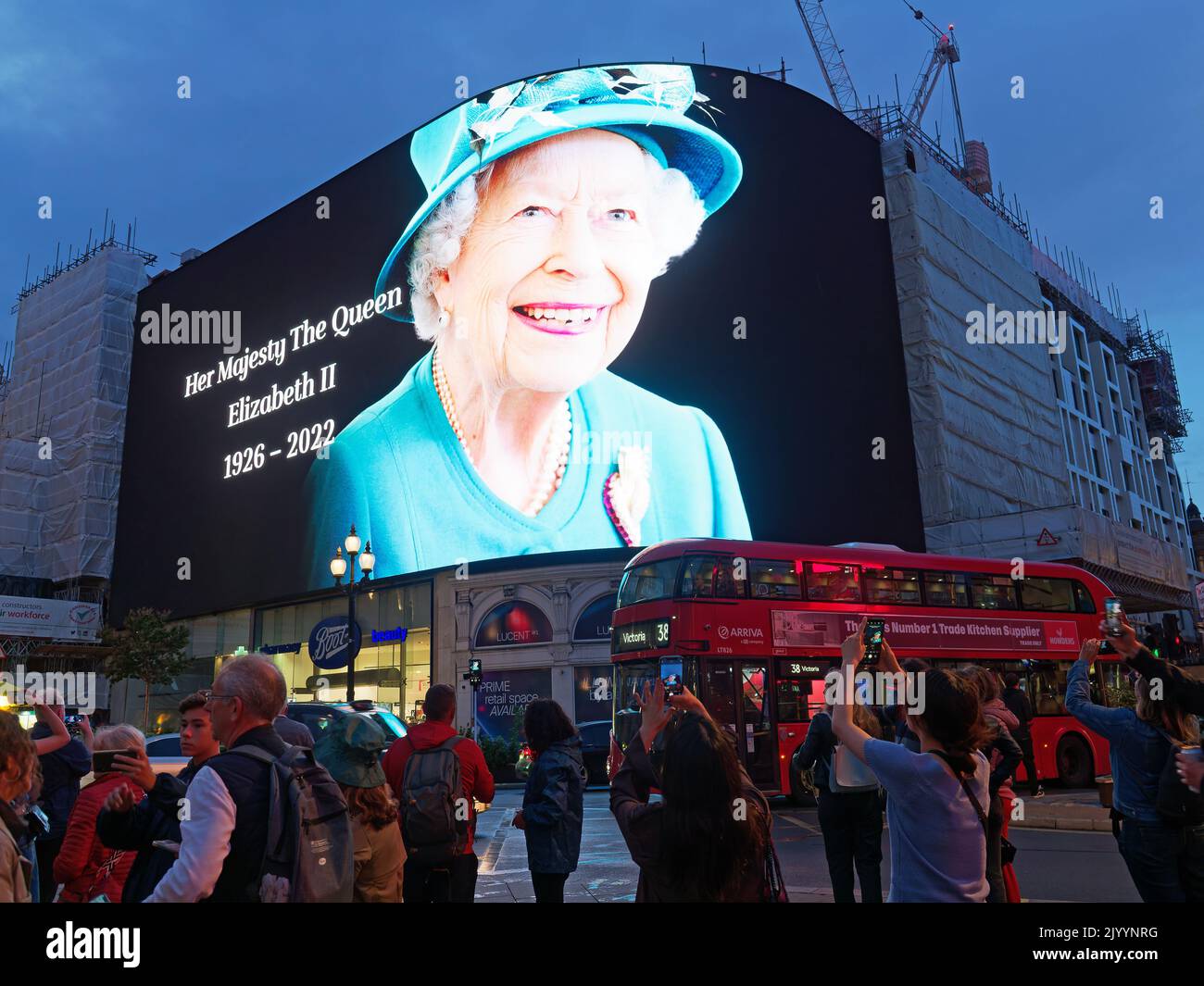 The large screen in Piccadilly Circus in London displaying a spectacular image of Queen Elizabeth II immediately following her death Stock Photo