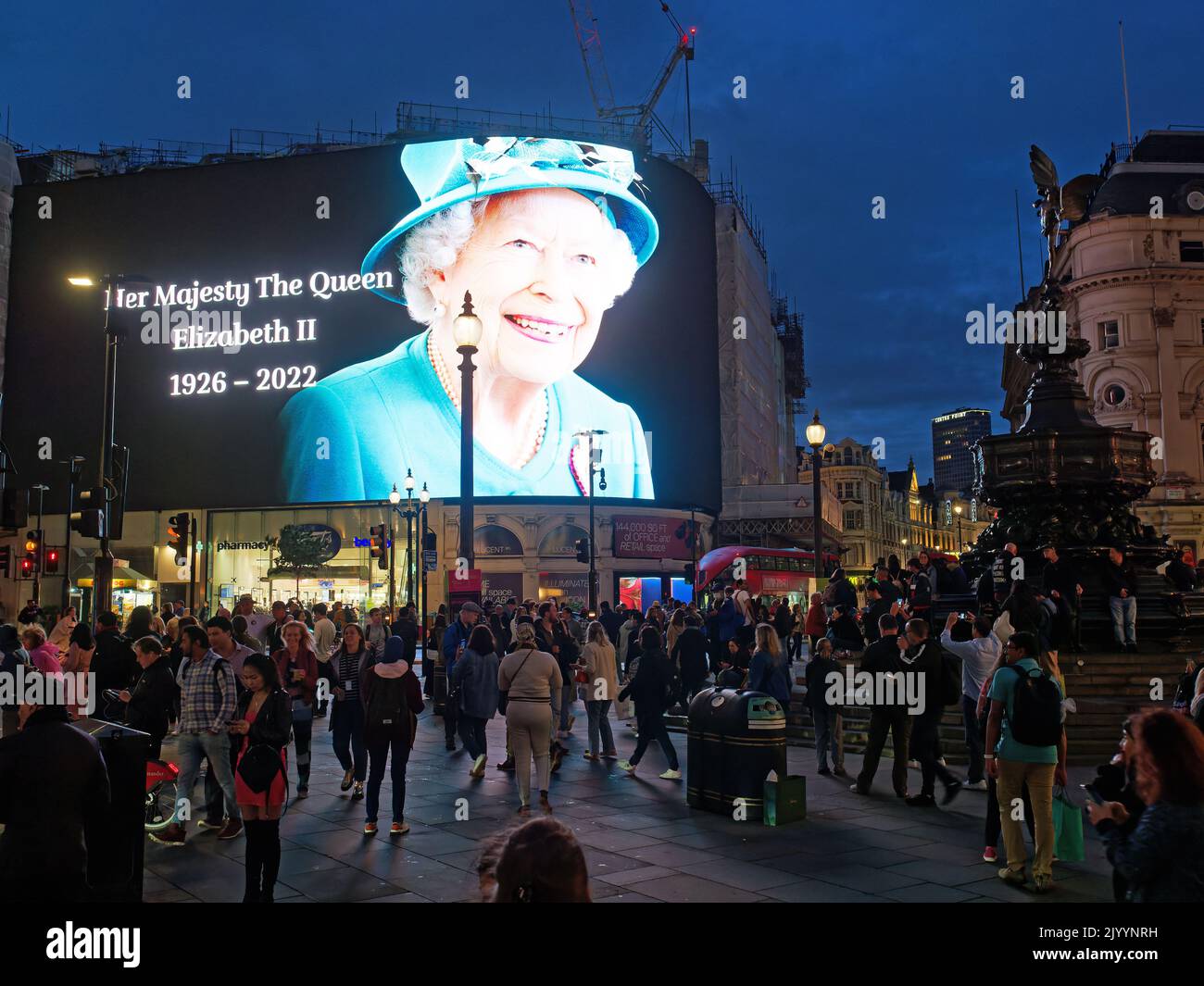 The large screen in Piccadilly Circus in London displaying a spectacular image of Queen Elizabeth II immediately following her death Stock Photo