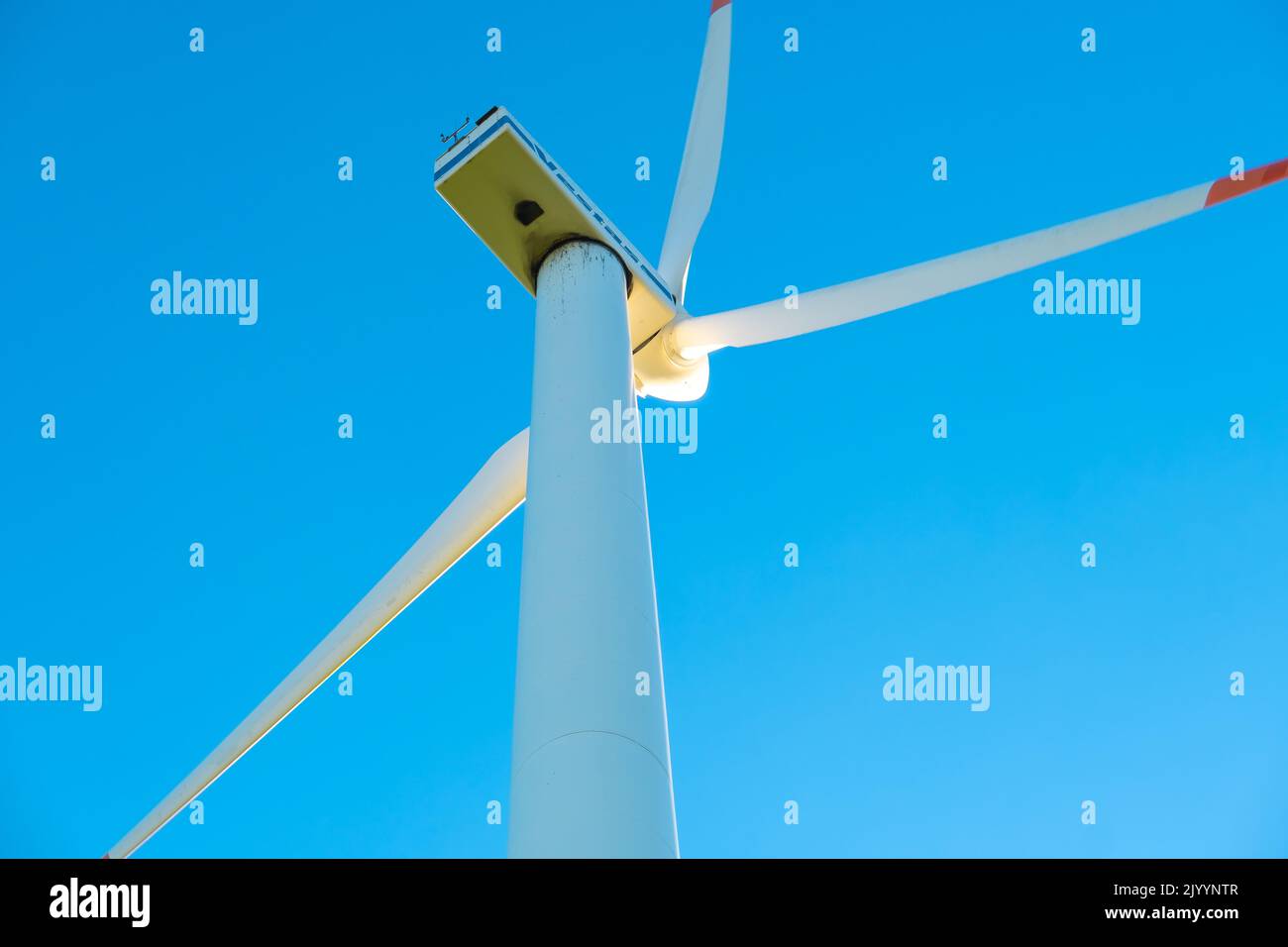 Wind generator on a blue sky background.Natural renewable clean energy