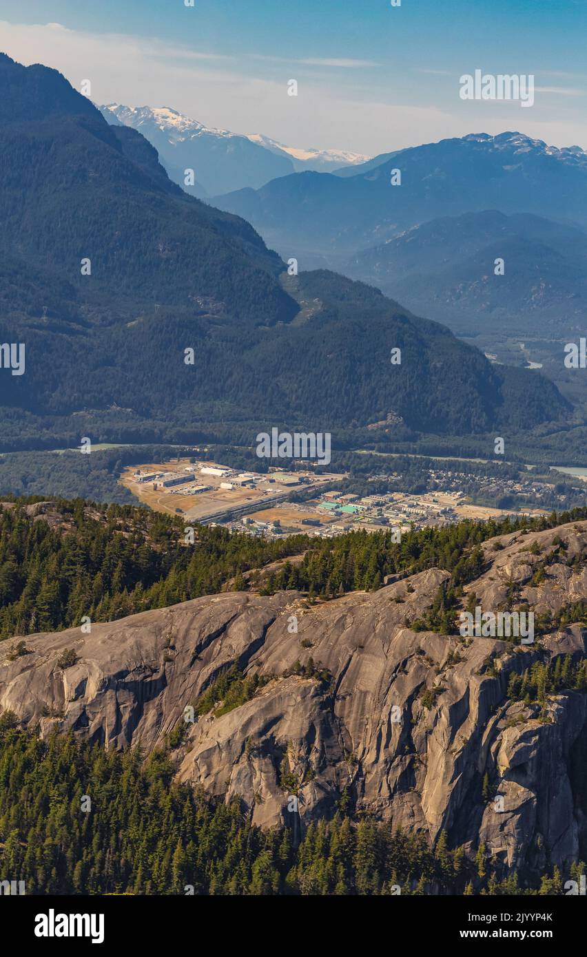 Squamish City, North of Vancouver BC Canada. Scenic landscape of the Squamish on a sunny day viewed from the summit of the chief. Industry and nature. Stock Photo