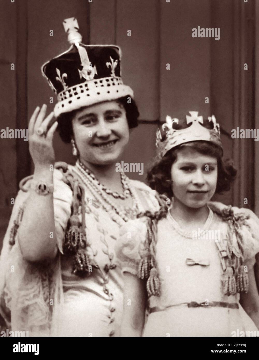 Queen Elizabeth and her eldest daughter Princess Elizabeth (later Queen Elizabeth II) on the balcony of Buckingham Palace after the coronation of King George VI on May 12, 1937. Stock Photo