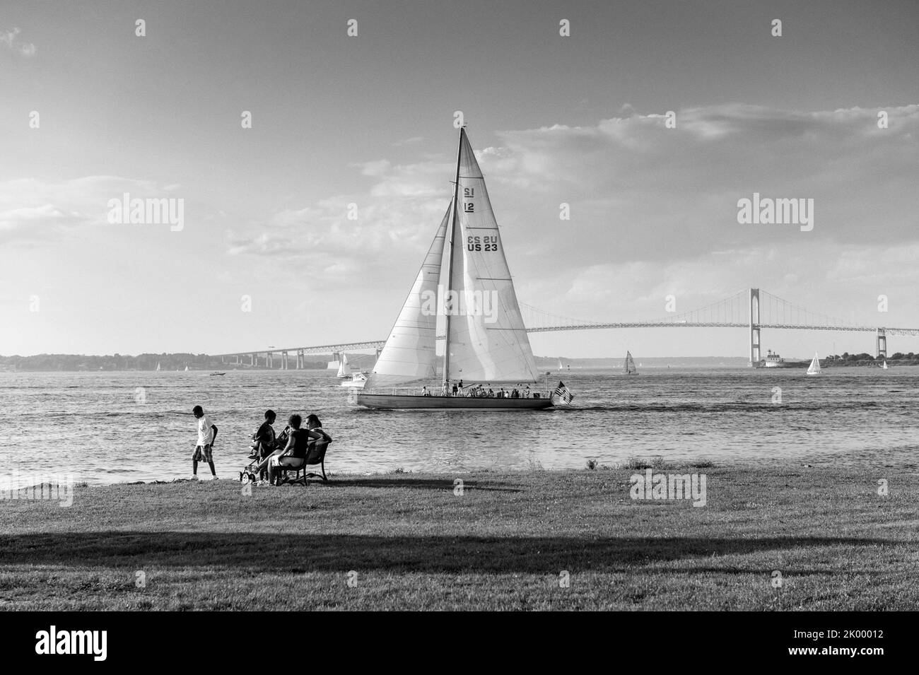Newport Rhode Island peaceful summer scene with sailboats and Claiborne Pell Newport bridge in black and white Stock Photo