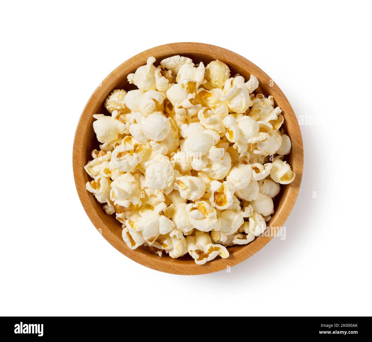 Popcorn in a wooden bowl placed on a white background. View from above