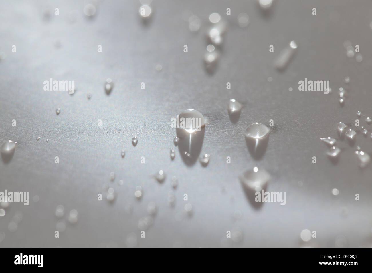 Water drops on a water-repellent material, a fabric that protects from rain and water Stock Photo