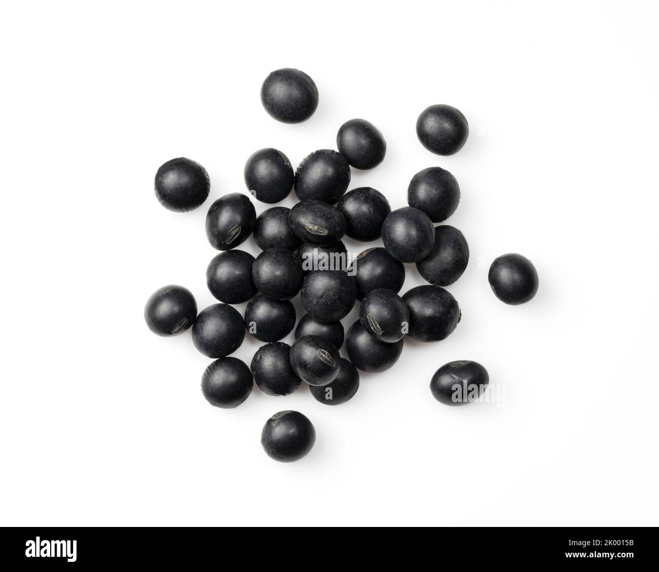 Black beans placed on a white background. Black soybeans (kurodazu). View from directly above
