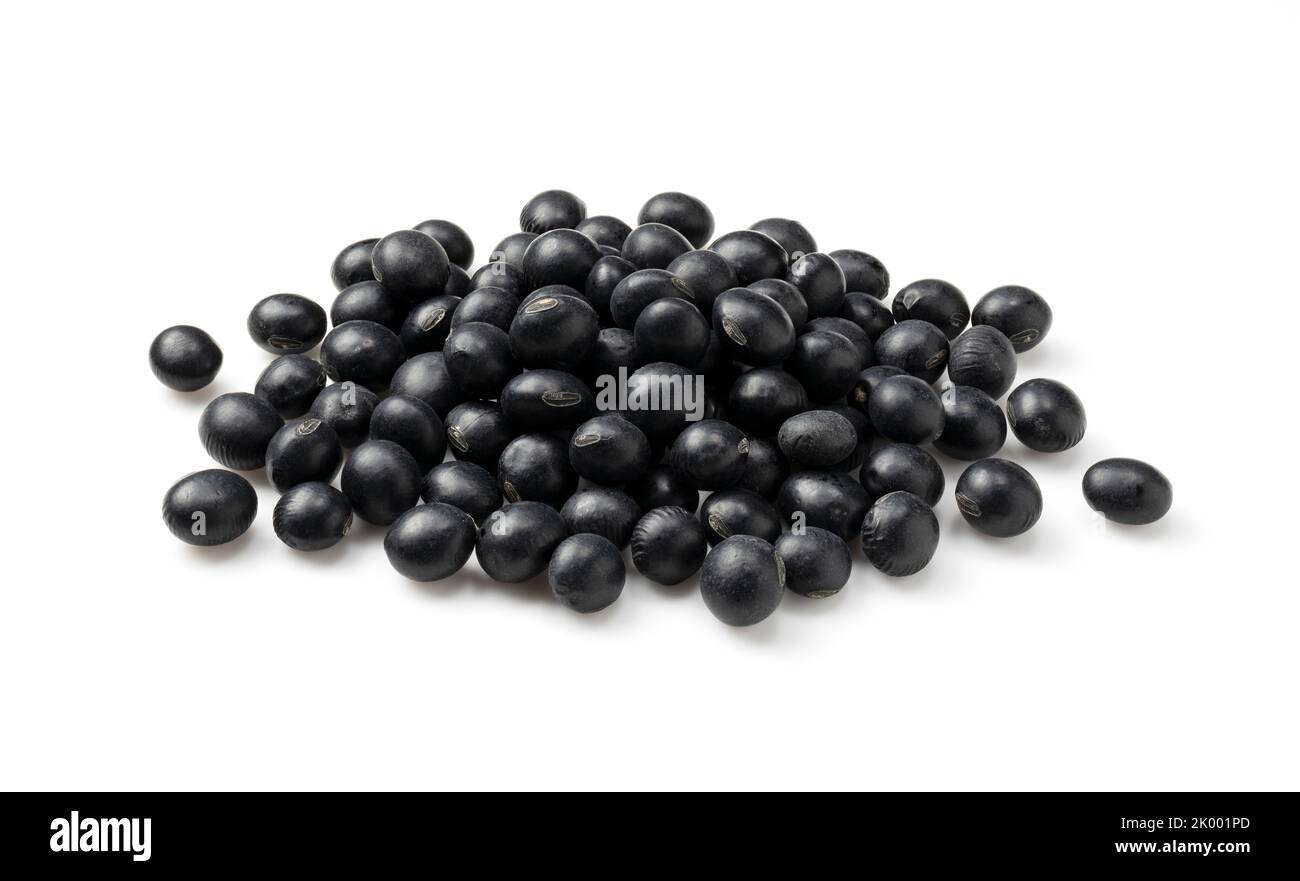 Black soybeans placed on a white background. Black soybeans (kurodazu