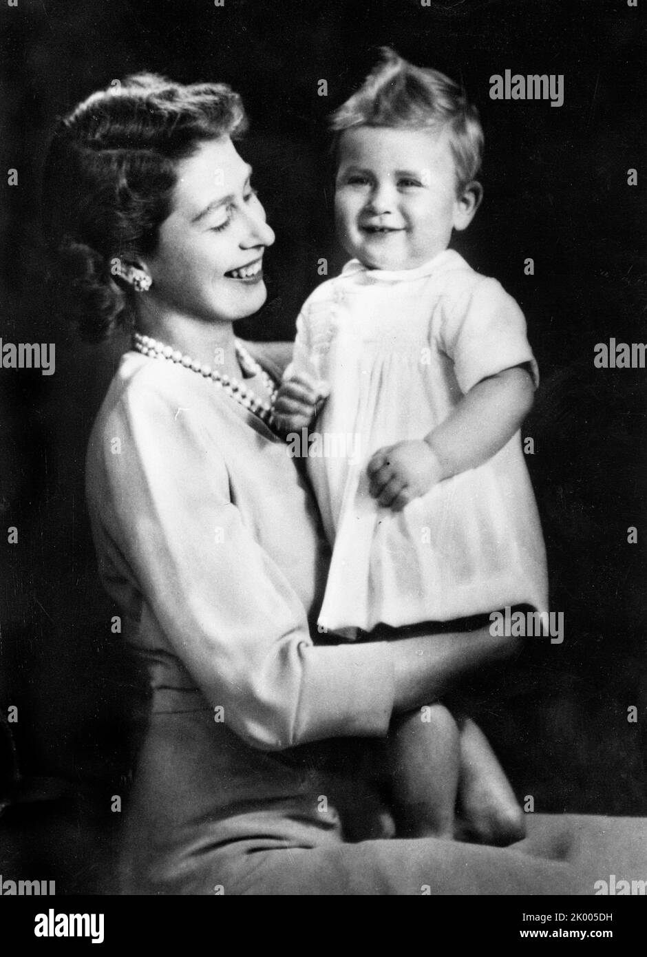 Nov. 12, 1949 - London, England, U.K. - QUEEN ELIZABETH II holds her oldest son, PRINCE CHARLES on his first birthday. (Credit Image: ¬ © Keystone Press Agency/ZUMA Press Wire) Stock Photo