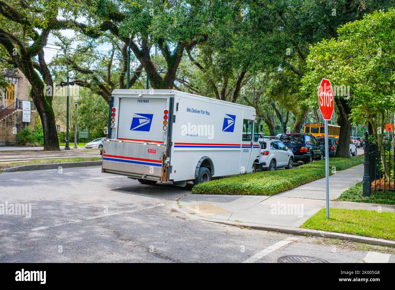 NEW ORLEANS, LA, USA - SEPTEMBER 7, 2022: Full side view of illegally parked United States Postal Service van on St. Charles Avenue Stock Photo