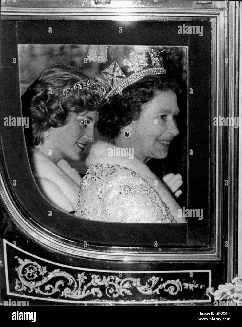 Jul. 07, 1983 - London, England, United Kingdom - PRINCESS DIANA, left, took a rare back seat when she accompanied QUEEN ELIZABETH, right, riding in the horse-drawn coach on their way to the State Opening of Parliament. But just a few hours later, Diana was back in the centre of attention when she called on a meeting of playgroup organizers. She has been interested in playgroups since she worked in one for several years. (Credit Image: © Keystone Press Agency/ZUMA Press Wire) Stock Photo