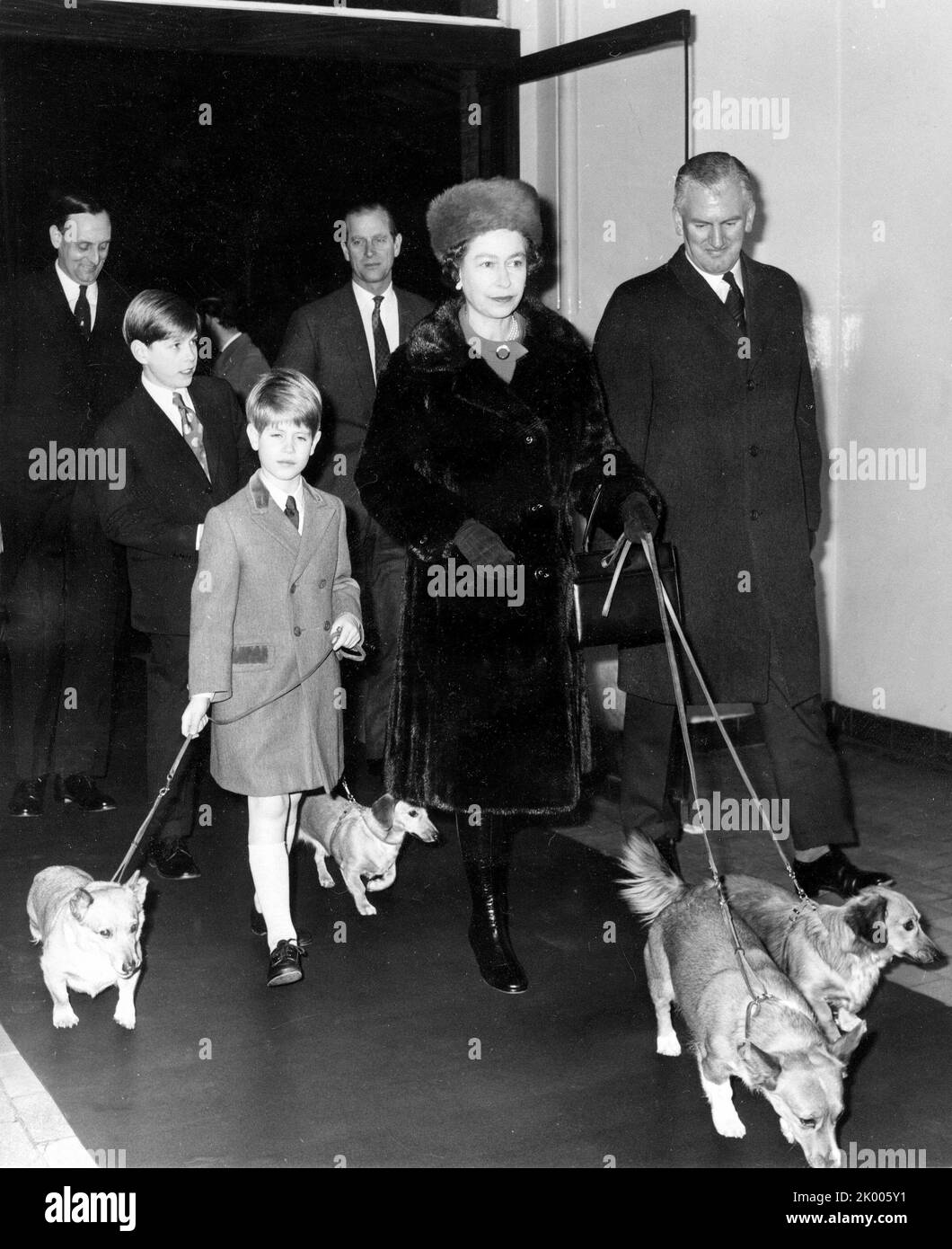 Dec. 29, 1971 - London, England, U.K. - The Royal Family leave for Sandringham from Liverpool Street Station. QUEEN ELIZABETH II, center, and PRINCE PHILIP, fourth from left, walk with their two youngest sons, PRINCE ANDREW, second from left, and PRINCE EDWARD, third from left, walk with the family dogs on their way to the train. (Credit Image: ¬ © Keystone Press Agency/ZUMA Press Wire) Stock Photo