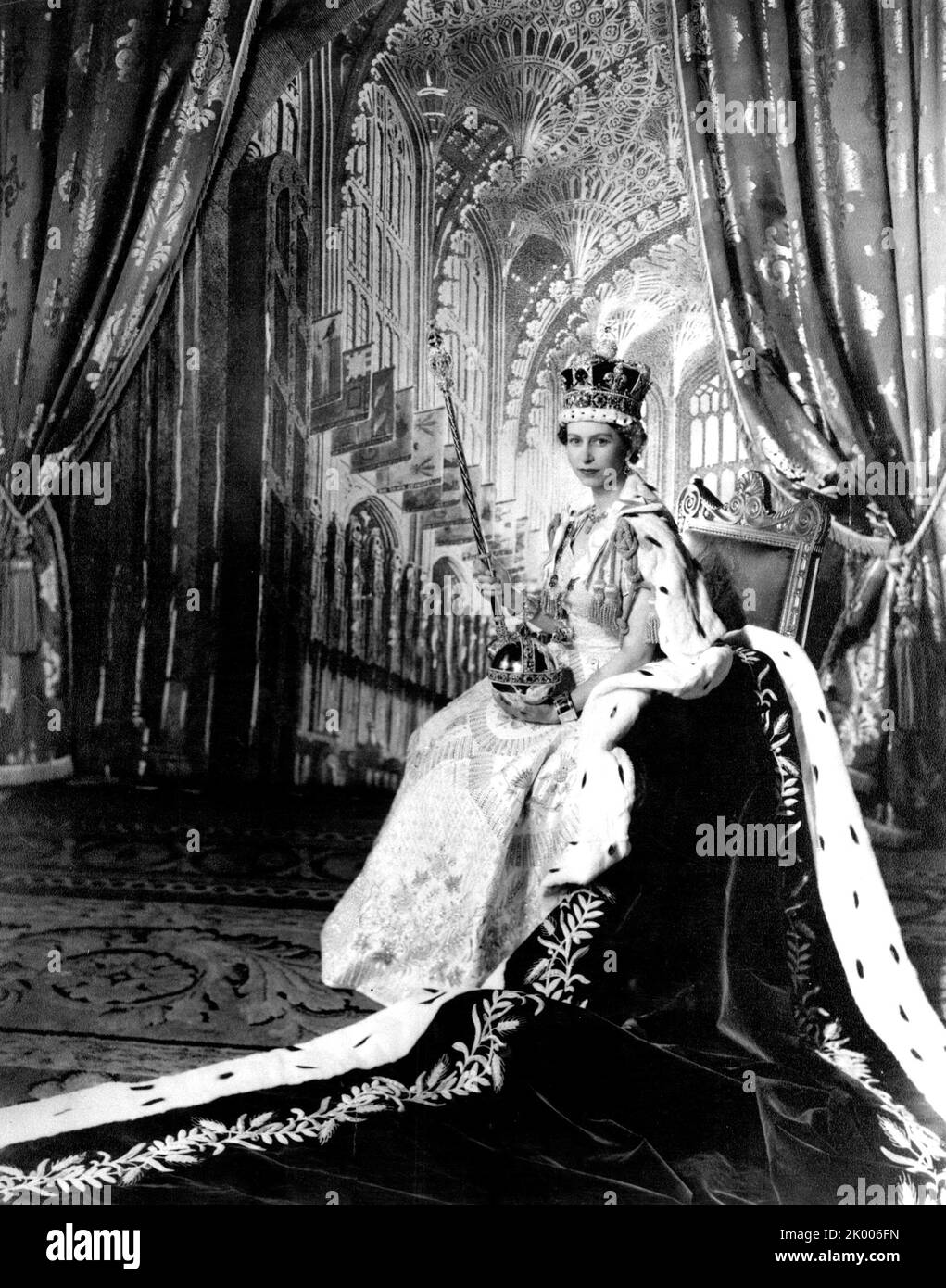 Jun. 2, 1953 - London, England, United Kingdom - QUEEN ELIZABETH II posed for this picture made by C Beaton in the Throne Room at Buckingham Palace after her Coronation on June 2nd.1953. She is attired in her Coronation dress and her purple velvet robe. On her head is the Imperial State Crown. In her left hand she holds the Orb, and in her right the Sceptre with Cross. On her wrists she wears the Armills, or bracelets of Sincerity. (Credit Image: © Keystone Press Agency/ZUMA Press Wire) Stock Photo